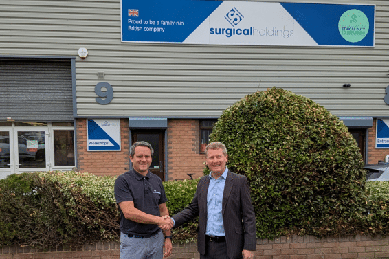 Edward Garston and Daniel Coole shaking hands outside Surgical Holdings