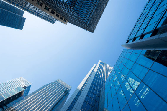 skyscrapers looking up at the sky in a city
